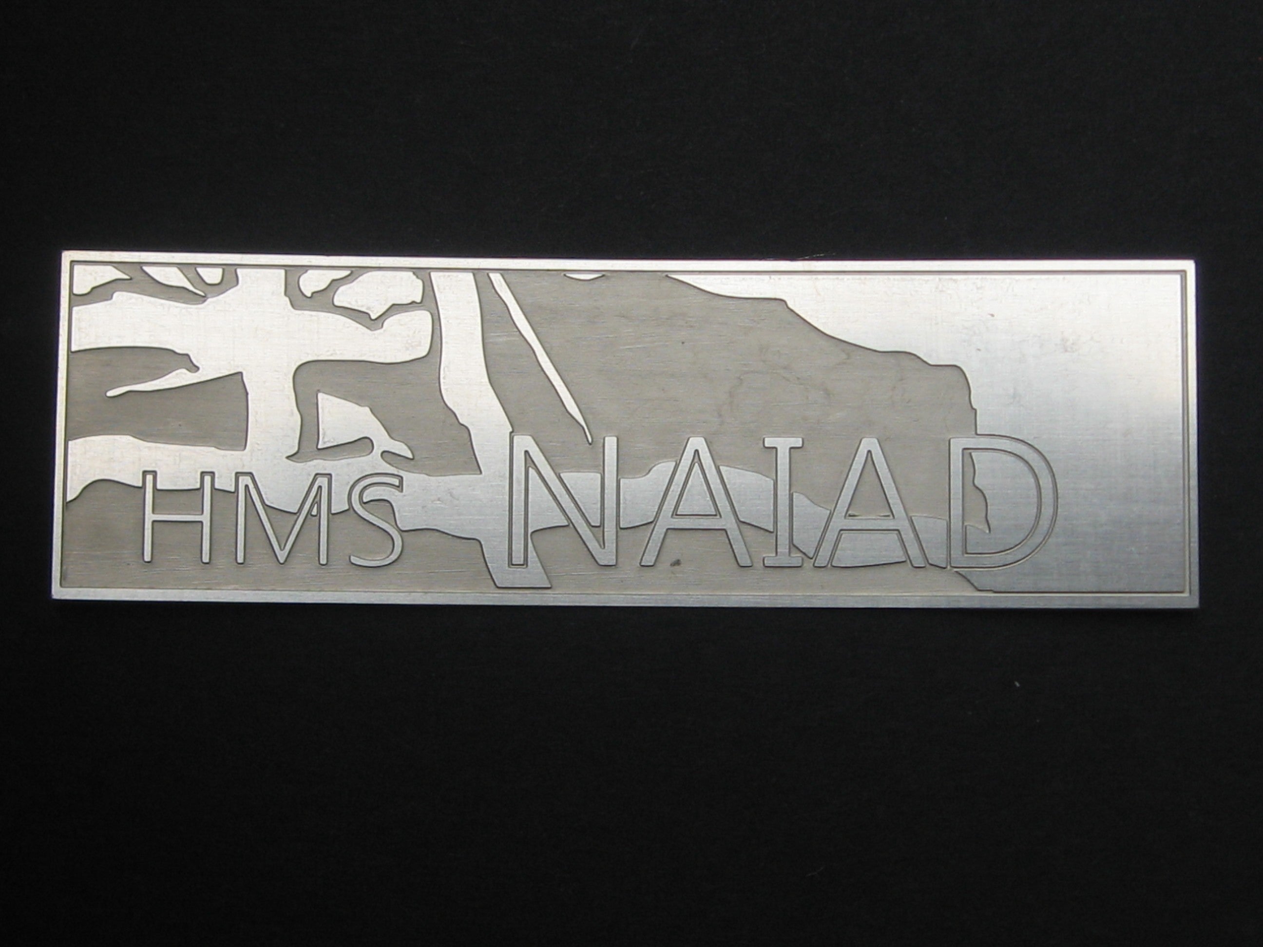 HMS Naiad nameplate